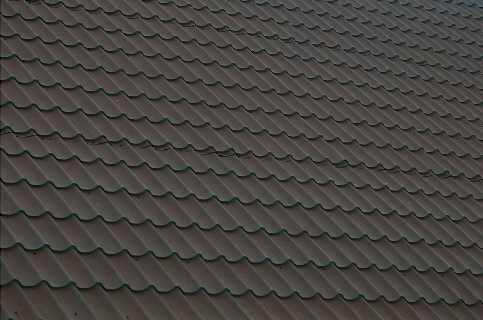 Brown metal roof tiles. Metal Roof Shingles - Roofing Construction